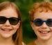 children smiling with sunglasses OJO